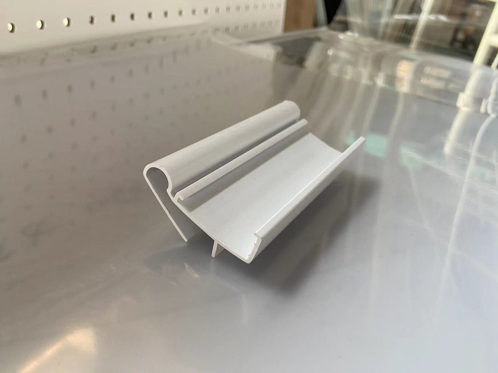 Plastic price label holder for retail shelf display
