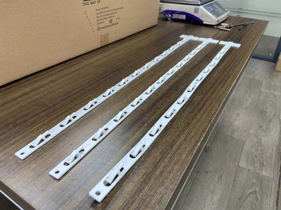 Plastic display hook strip