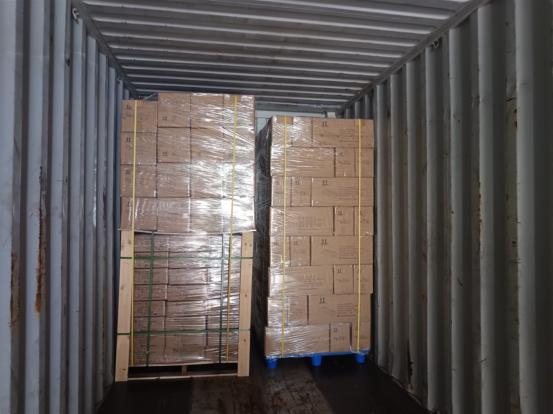 Palletized goods loaded into a shipping container